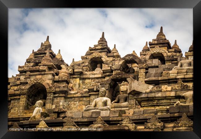 The upper section of the Borobudur Buddhist temple and clouds, Indonesia Framed Print by SnapT Photography