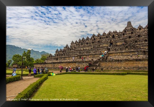 A line of tourists ascending the stairs on the Borobudur Buddhist temple, Indonesia Framed Print by SnapT Photography
