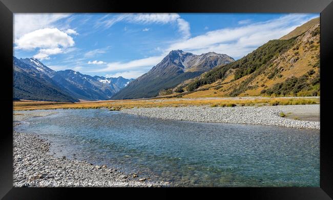 A shallow, fast flowing river, in the mountains of New Zealand on a sunny day Framed Print by SnapT Photography