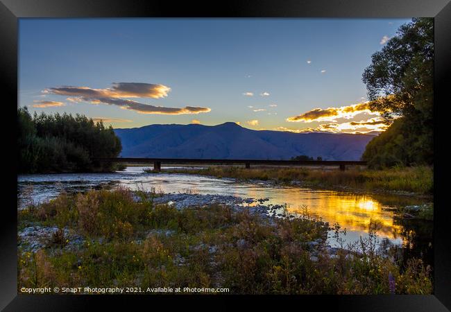 Sunset on the Tekapo River, with mountains in the background in summer Framed Print by SnapT Photography