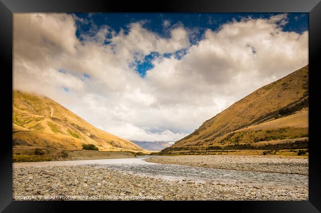 A New Zealand mountain stream in a V shaped valley with dramatic clouds Framed Print by SnapT Photography