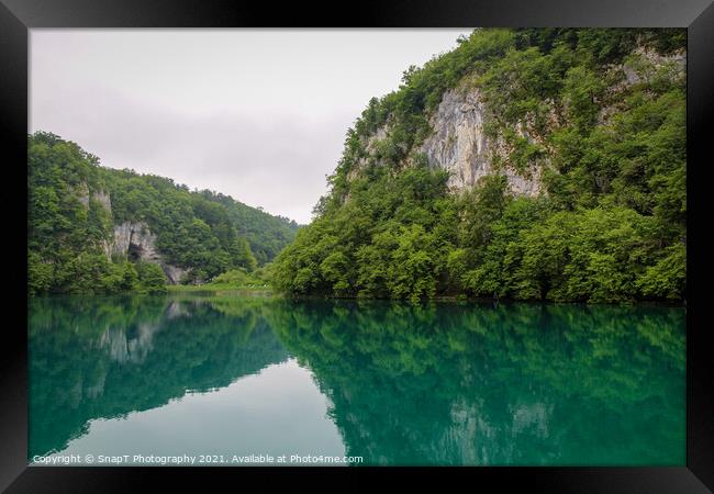 A reflection of a mountain valley on a lake at Plitvice Lakes, Croatia Framed Print by SnapT Photography