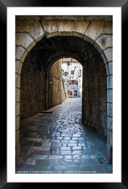 An alley way in the old town of Kotor, with flying brooms in the background Framed Mounted Print by SnapT Photography