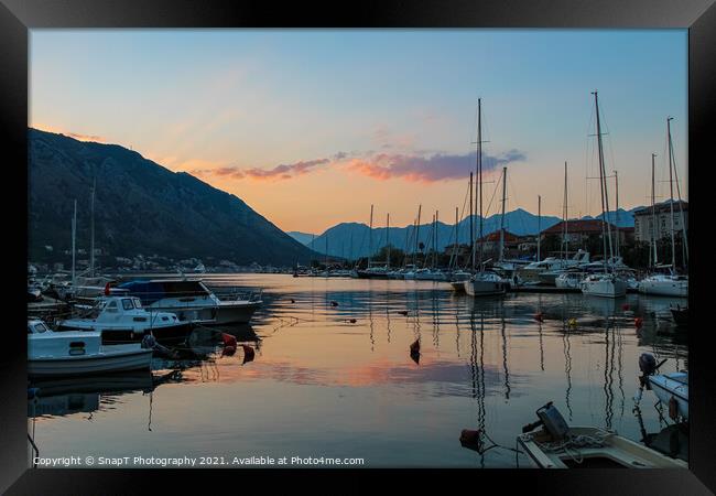 Boats moored in Kotor harbour at sunset, by the old town, Montenegro Framed Print by SnapT Photography