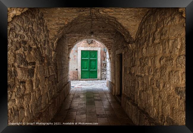 An alleyway in the old town of Kotor, Montenegro, with a green door at the end Framed Print by SnapT Photography