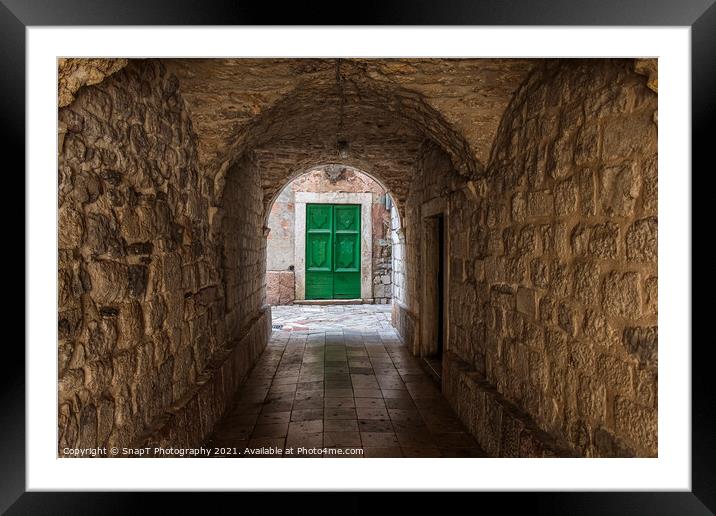 An alleyway in the old town of Kotor, Montenegro, with a green door at the end Framed Mounted Print by SnapT Photography