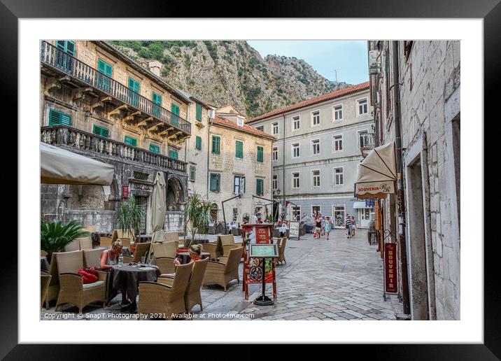 A cafe in a square at sunset, in the Old town of Kotor, Montenegro Framed Mounted Print by SnapT Photography
