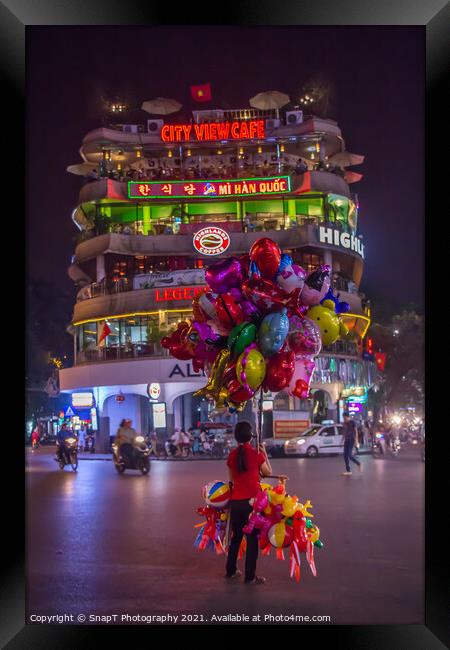 A lone balloon sellar at Dong Kinh Nghia Thuc Square, Hanoi, Vietnam. Framed Print by SnapT Photography