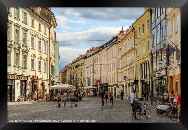 Bars and cafes in Mestni Trg, Ljubljana Town Square beside the town hall Framed Print by SnapT Photography