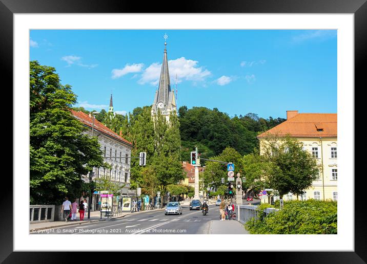 St. James Church over looking the St. James Bridge in Ljubljana, Slovenia Framed Mounted Print by SnapT Photography