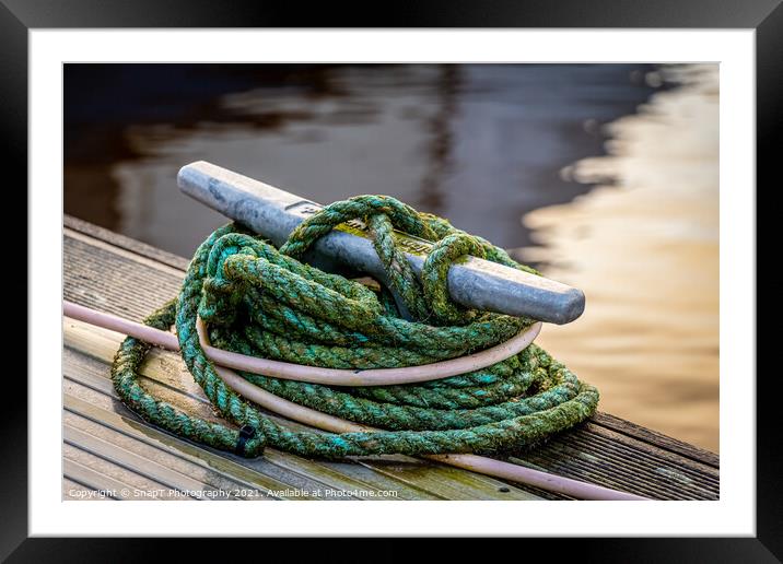 Rope tied around a metal bollard mooring on a wooden jetty Framed Mounted Print by SnapT Photography