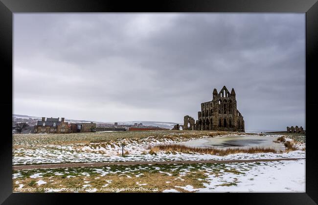 Whitby Abbey in the Snow  Framed Print by Michael Copestake