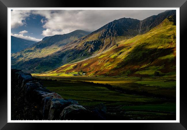 Sun dappled mountains in Snowdonia Framed Print by Peter Taylor
