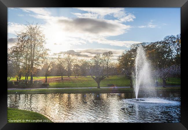 Fountain in a city park  Framed Print by Phil Longfoot