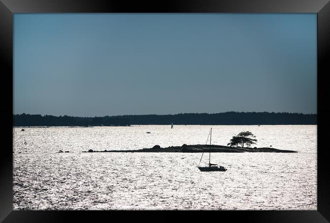 A Swedish Small Boat and Small Island Framed Print by Ron Thomas