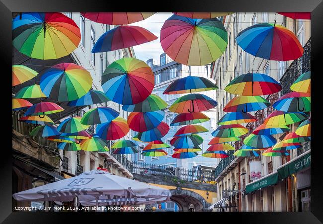Colourful Umbrella Street in Lisbon Framed Print by Jim Monk