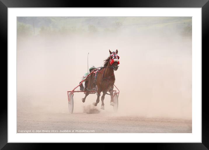 Crossing the finish line. Framed Mounted Print by Glyn Evans