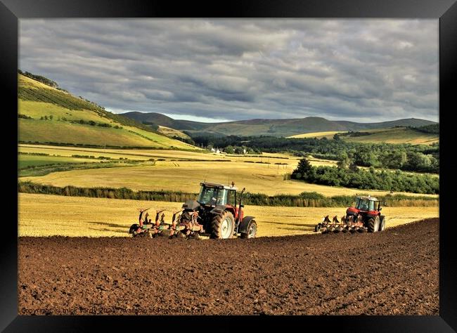 Ploughing in tandem Cheviot Hills. Framed Print by mick vardy
