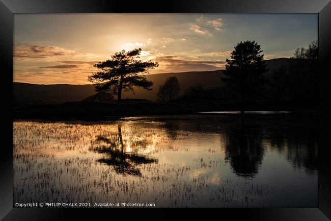 Dark sunset at Kelly hall tarn reflection in the l Framed Print by PHILIP CHALK