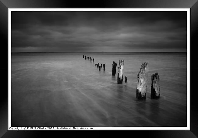 Sands end groynes  on a stormy day near Whitby bla Framed Print by PHILIP CHALK