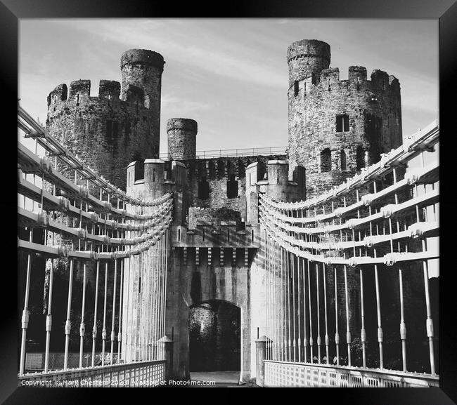 Conwy castle and toll bridge Black and White Framed Print by Mark Chesters