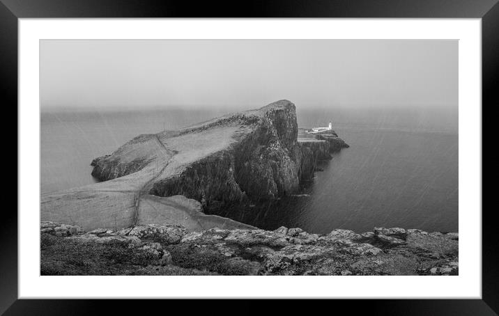 Neist Point Lighthouse in the snow  Framed Mounted Print by Anthony McGeever