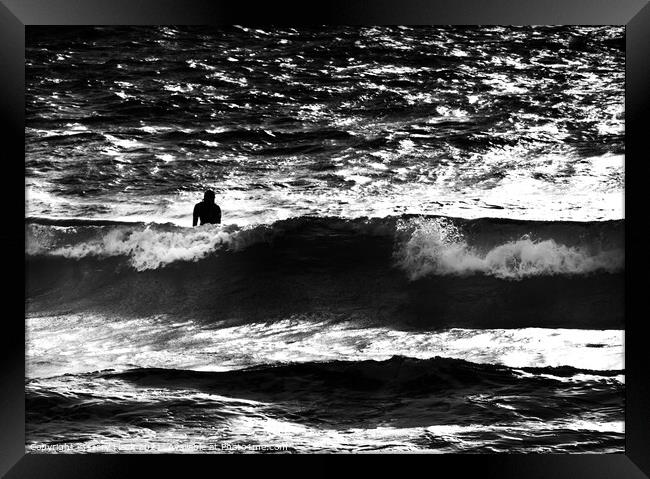 Silhouetted surfer in a large wave Framed Print by That Foto