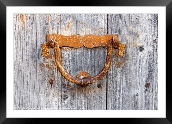 Old door knocker on a wooden door Framed Mounted Print by MallorcaScape Images