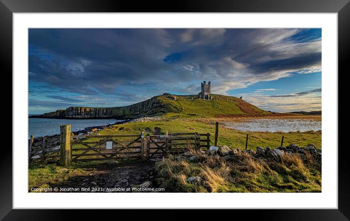 Winter Sun on Dunstanburgh Castle Framed Mounted Print by Jonathan Bird