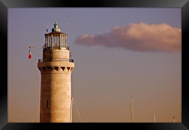 Lighthouse at sunset Framed Print by Massimiliano Leban