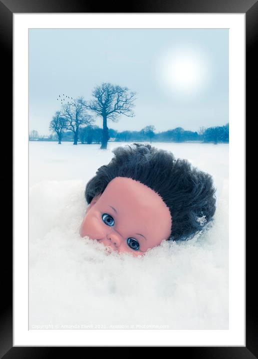 Dolls Head In Snow Framed Mounted Print by Amanda Elwell