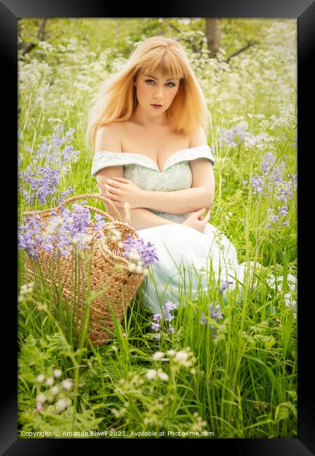 Woman Sitting In Spring Meadow Framed Print by Amanda Elwell