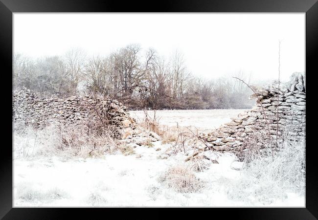 Crumbling stone wall in Winter Framed Print by Peter Greenway