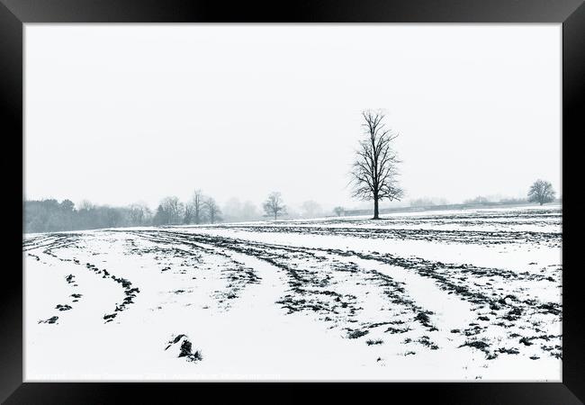 Lone Tree Amid A Snow Covered Ploughed Field Framed Print by Peter Greenway