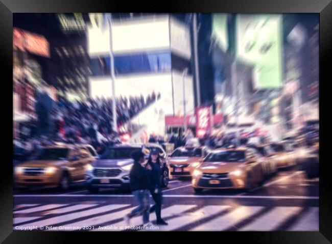 The Bustle Of Times Square in NYC At Night Framed Print by Peter Greenway