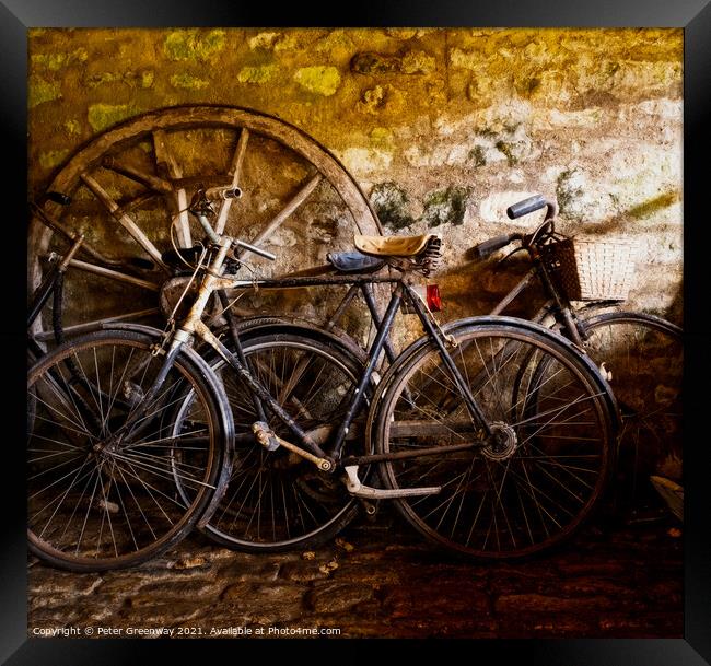 Old Pedal Cycles Propped Up Against A Barn Wall Framed Print by Peter Greenway
