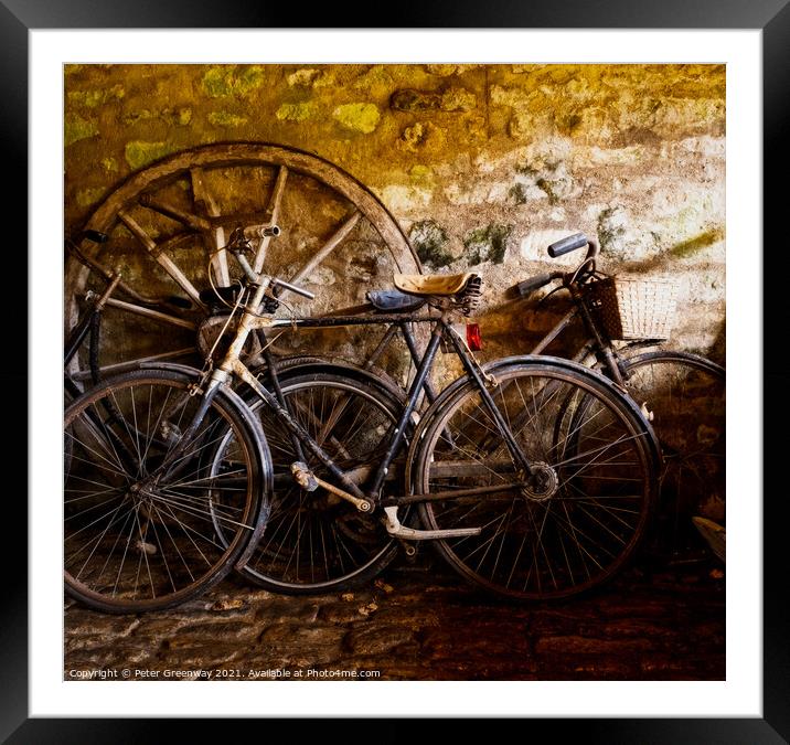 Old Pedal Cycles Propped Up Against A Barn Wall Framed Mounted Print by Peter Greenway