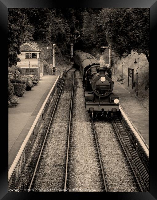 Steam Train & Carriages Arriving At A Quaint English Railway Station Framed Print by Peter Greenway