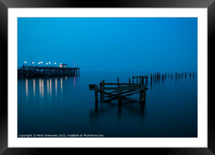 The Remains Of The Old Pier At Swanage, Dorset At Night Framed Mounted Print by Peter Greenway