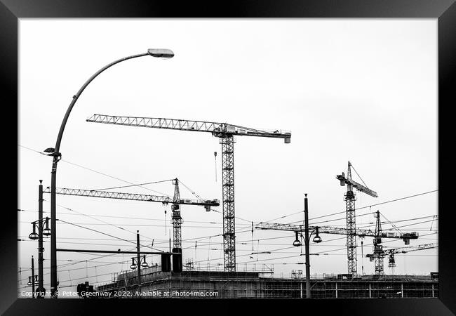 Cranes On A Building Site In Berlin Framed Print by Peter Greenway