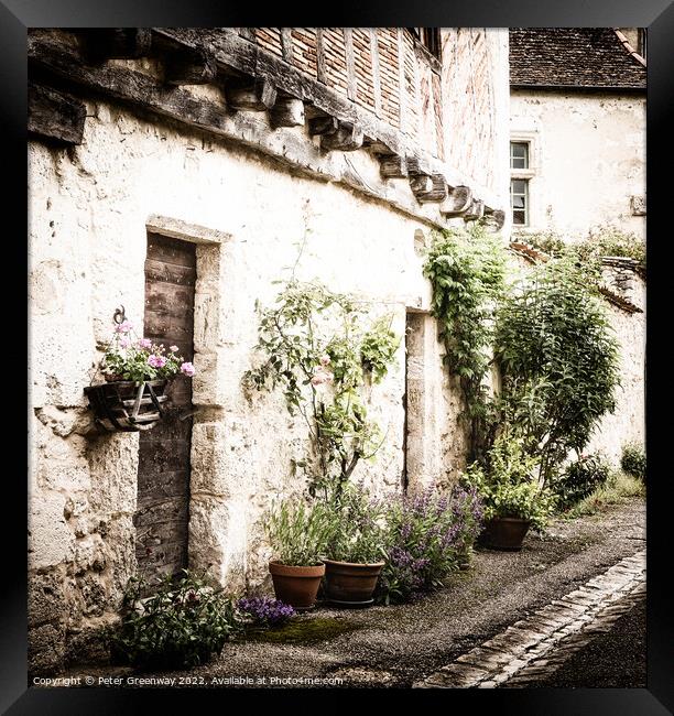 Pots Of Plants Outside A Residential Street In Medieval Issigeac Framed Print by Peter Greenway