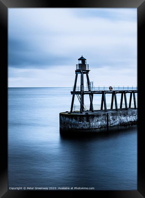 The Red Shipping Lighthouse On The East Pier At Whitby On A Cold Framed Print by Peter Greenway
