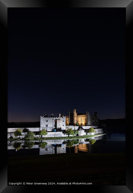 Leeds Castle Illuminated On A Winters Night Framed Print by Peter Greenway