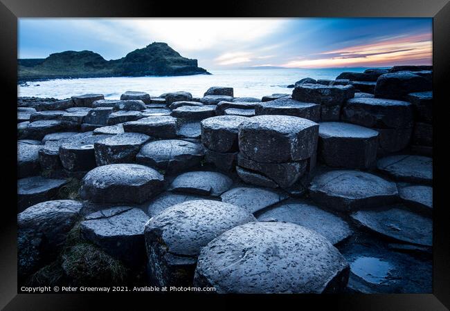 The Basalt Columns At The Giants Causeway At Sunse Framed Print by Peter Greenway
