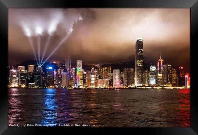 Laser Light Show Over Victoria Harbour At Tsim Sha Tsui, Hong Kong Framed Print by Peter Greenway