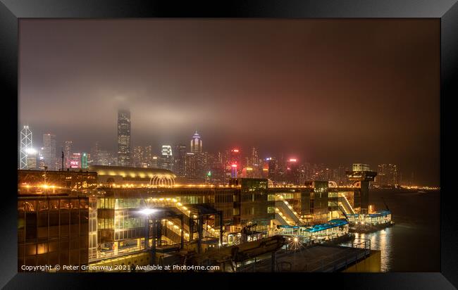 China Ferry Terminal, Hong Kong Illuminated At Night Framed Print by Peter Greenway