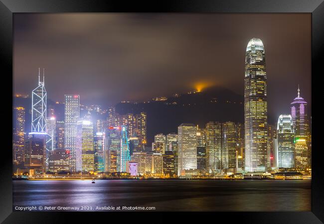 Tsim Shat Sui Victoria Harbour In Hong Kong At Night Framed Print by Peter Greenway