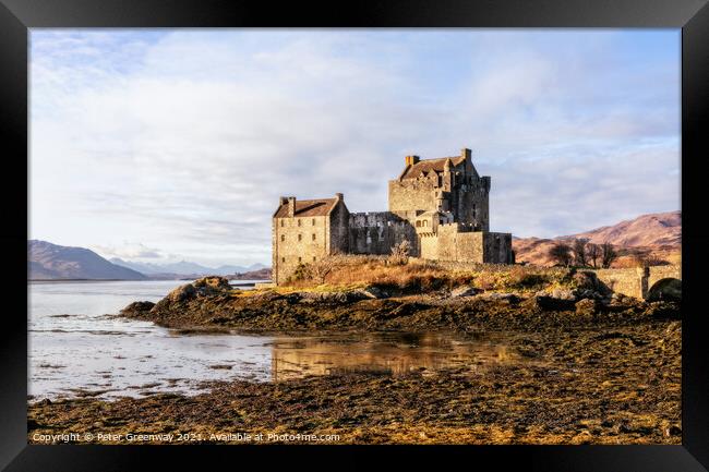 Winter Sunshine On Eilean Donan Castle in the Scotish Highlands Framed Print by Peter Greenway