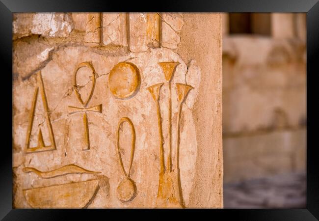 Egyptian hieroglyphs at the Mortuary Temple of Hatshepsut in Luxor, Egypt Framed Print by Mirko Kuzmanovic