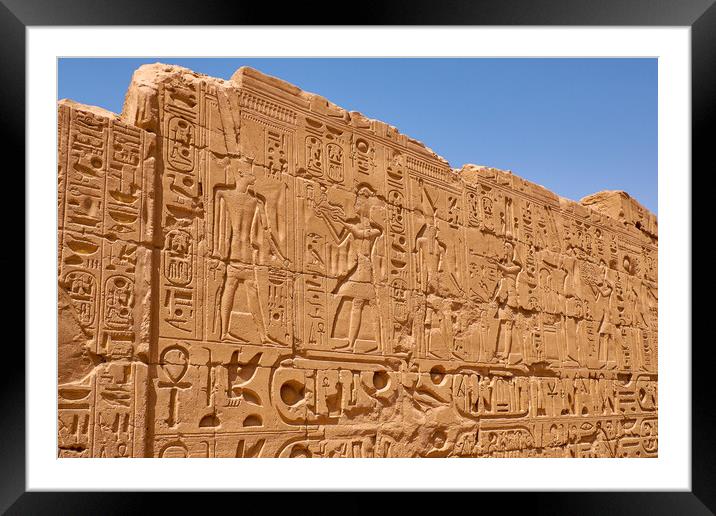 Relief details and Egyptian hieroglyphs at Karnak temple in Luxor, Egypt Framed Mounted Print by Mirko Kuzmanovic